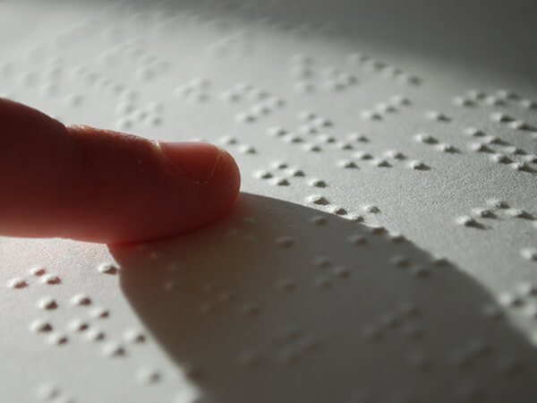 2019-07-15-closeup-person-reading-braille-cc-by-stefan-malmesjocc88-600x450